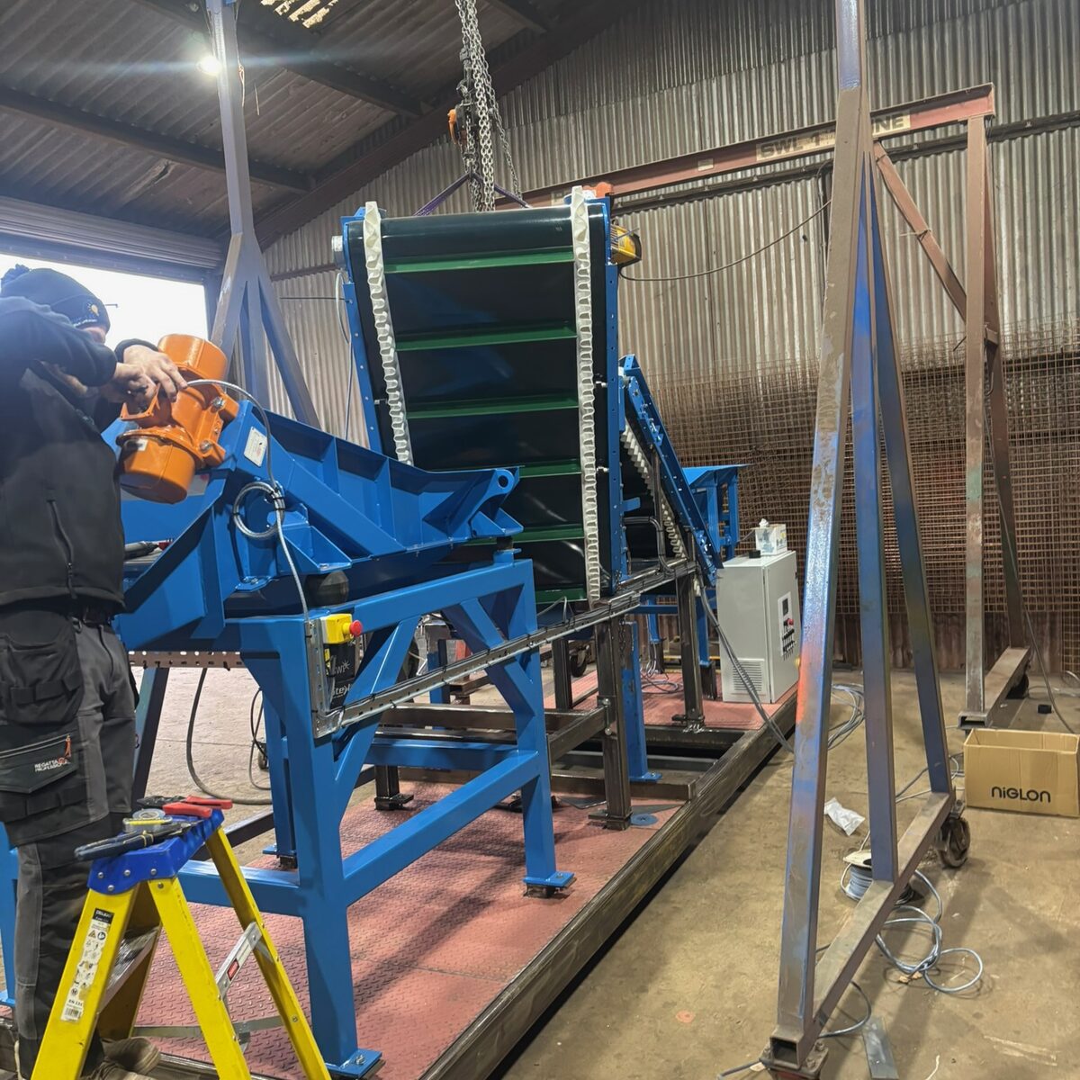 Conveyor frame during assembly in the barn