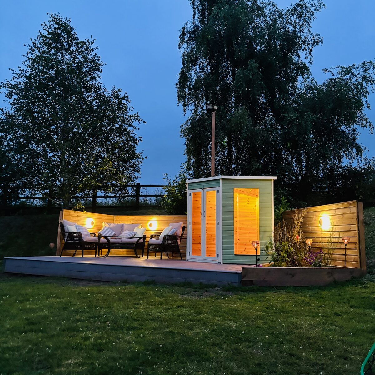 Warm exterior lighting across the seating area