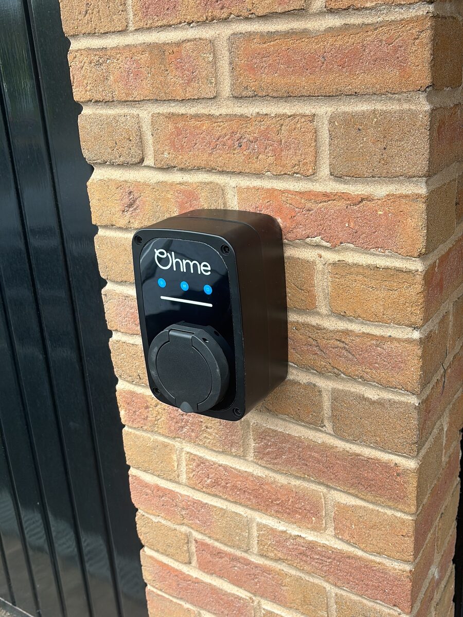 Wall-mounted smart charger on brick