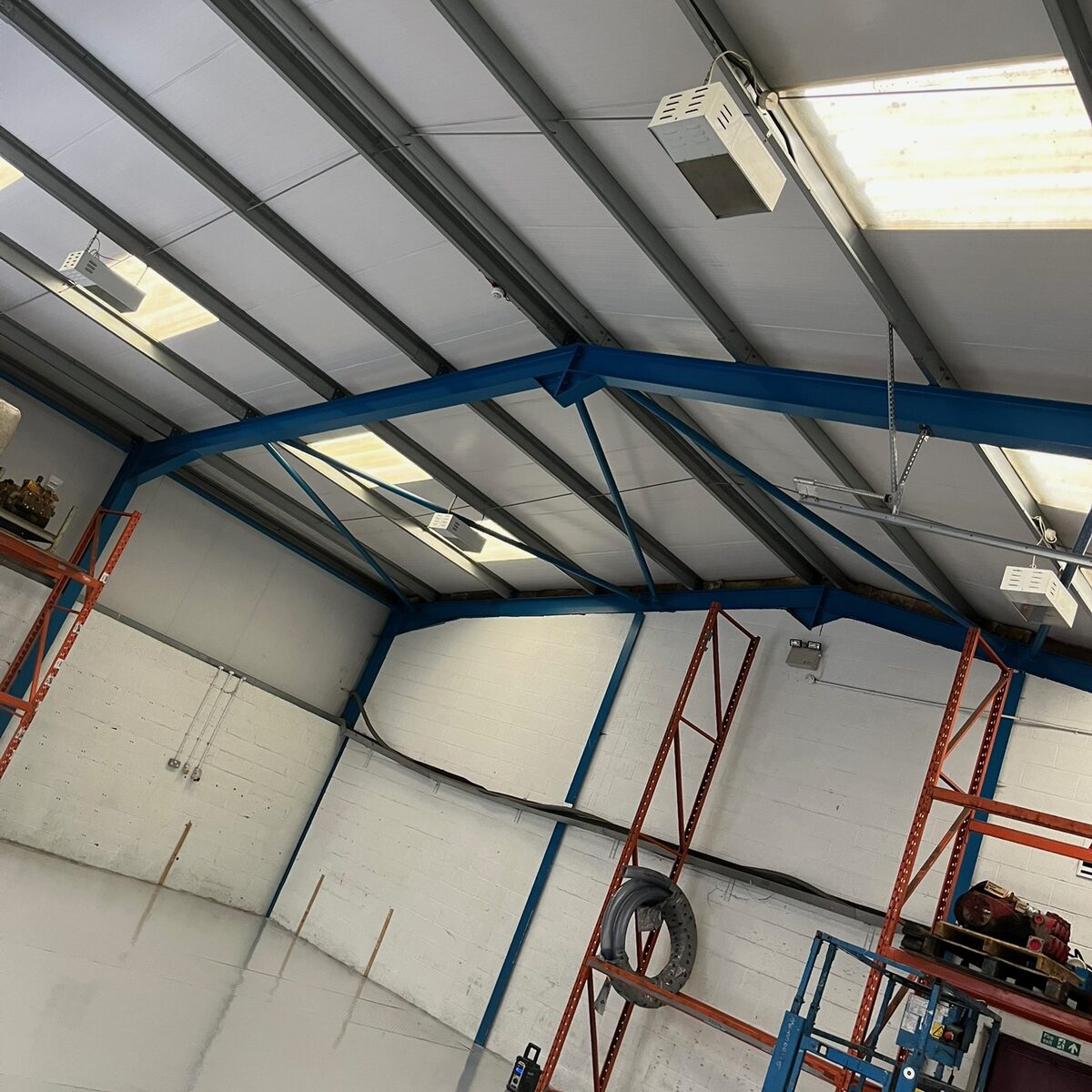 High-level LED runs across the showroom steelwork