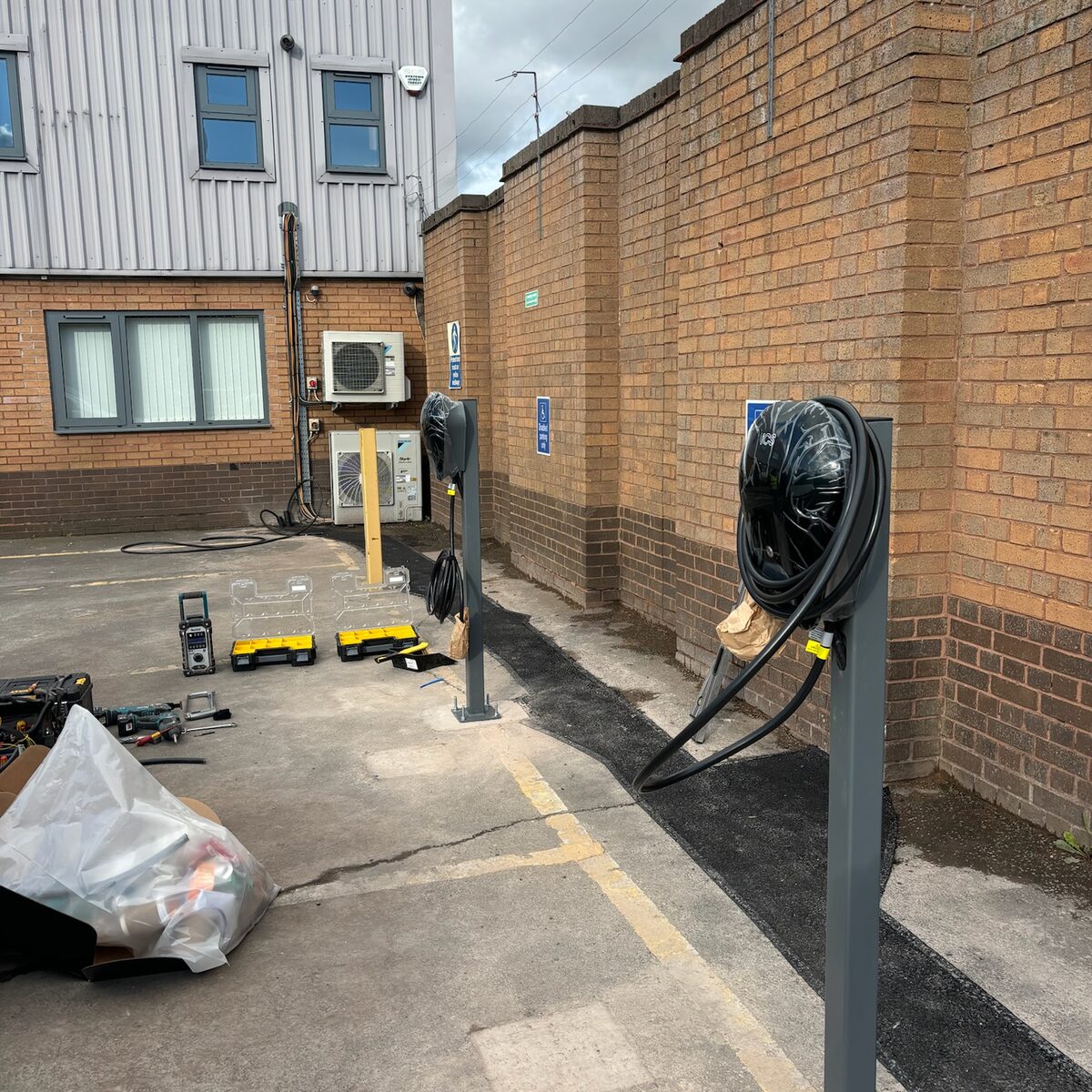Charge points and hoop barriers along the building